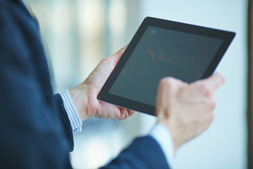 men holding digital tablet