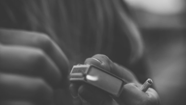 Woman striking a match close up