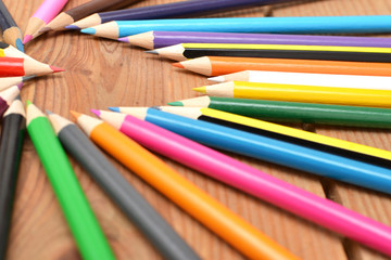 Colored pencils on wood with heart form