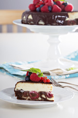 Cheesecake with berries on a brownie layer
