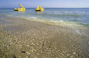 Fototapeta na wymiar Yellow lifeboat on the beach.