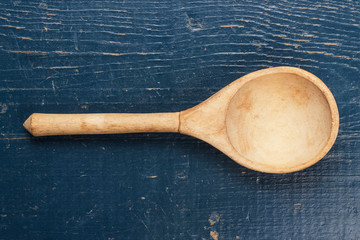 wooden spoon on the blue table