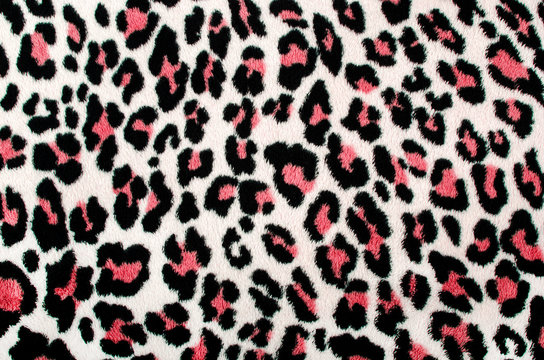 Red black leopard pattern.Spotted fur animal print as background