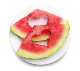 Slices of watermelon with cut out heart shape