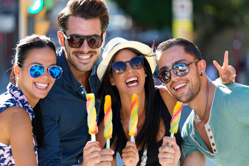 Portrait of group of friends eating ice cream.