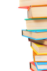 Multi-coloured books. On white background.