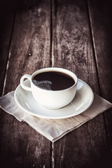 Black coffee on a wooden table