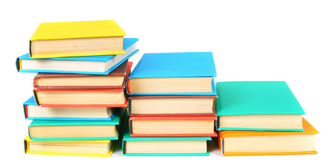 Multi-coloured books. On white background.