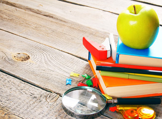School tools. On wooden background.