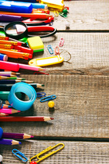 School tools. On wooden background.