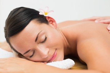 Obraz na płótnie Canvas Peaceful brunette enjoying a back massage
