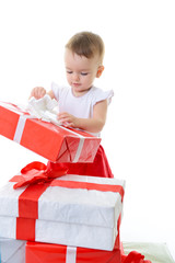 Holidays, baby girl opening box with presents, christmas, birthd