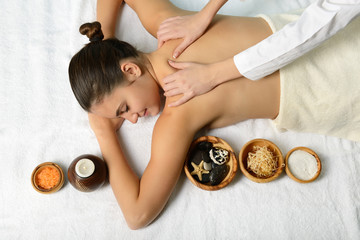 portrait of young beautiful woman in spa environment gets massag © Khorzhevska