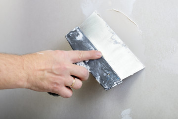 repairman works with plasterboard, plastering dry-stone wall, ho - obrazy, fototapety, plakaty