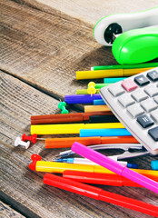 School tools. On wooden background.