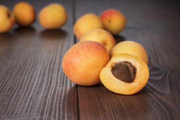 Naklejka na ściany i meble some fresh apricots over wooden background