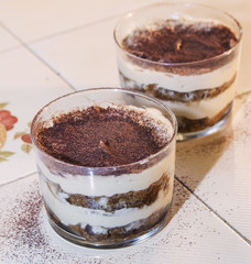 Traditional italian dessert tiramisu in a glass