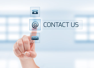 Female hand touching contact us button.