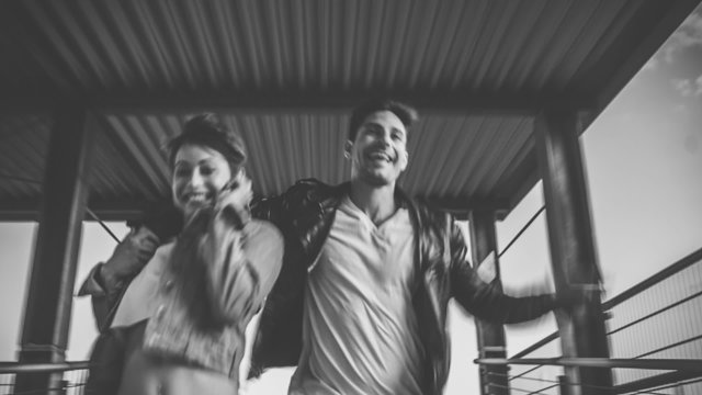 Couple Running on Rooftop