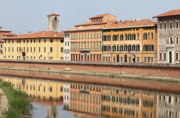 Fototapeta na wymiar River Arno and city embankment. Pisa, Italy