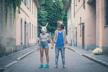 horse and rabbit mask couple of friends young  man and woman