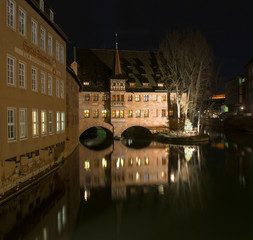 Monastery Holy Spirit Hospice and bridge at night in Nuremberg