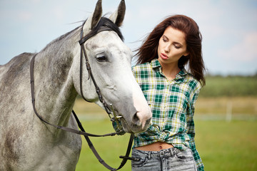 Obraz premium Woman with a white horse