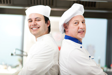 Couple of chefs in the kitchen