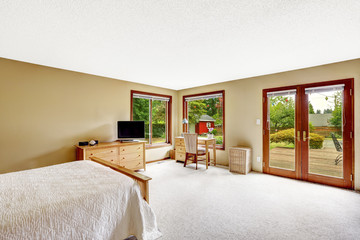 Bedroom with walkout basement deck