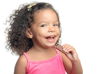 Little girl with an afro hairstyle eating a chocolate cookie