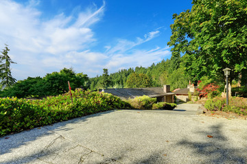 House with uphill driveway
