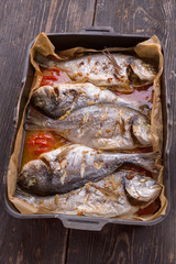 seabass fish on a baking sheet