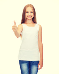 Fototapeta na wymiar girl in blank white shirt showing thumbs up