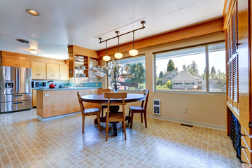 Spacious kitchen room with round dining table