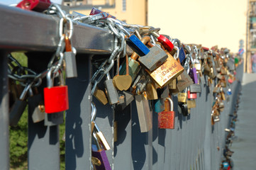 Padlocks left by lovers on bridge in Poznan, Poland