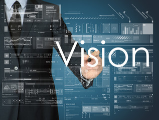 the businessman is writing Vision on board with some diagrams