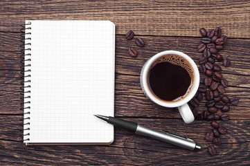 Notepad and cup of coffee