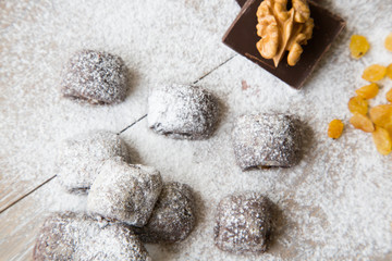 Fototapeta na wymiar Small chocolate biscuits with raisins and wallnuts.