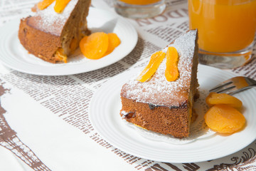 A piece of homemade apricot pie on the white plate