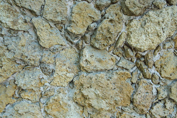 Clothed wall in stones and concrete