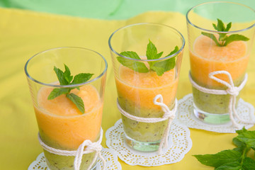 Three glasses of smoothie melon-kiwi