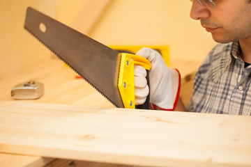 Carpenter cutting wood