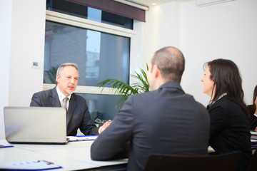 Businessman talking to a couple