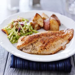 Fotobehang pan fried tilapia with asian slaw and roasted potatoes © Joshua Resnick