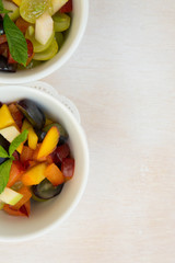 Fruit salad in white dishes