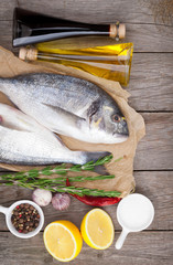 Fresh dorado fish cooking with spices and condiments