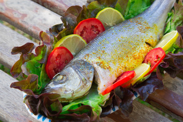 Baked sea bass with vegetables