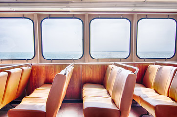  ferry boat cabin and rows of seats looking out the window