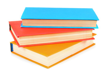 Multi-coloured books. On white background.