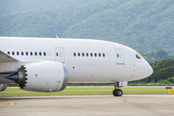 Commercial airplane taxiing to runway